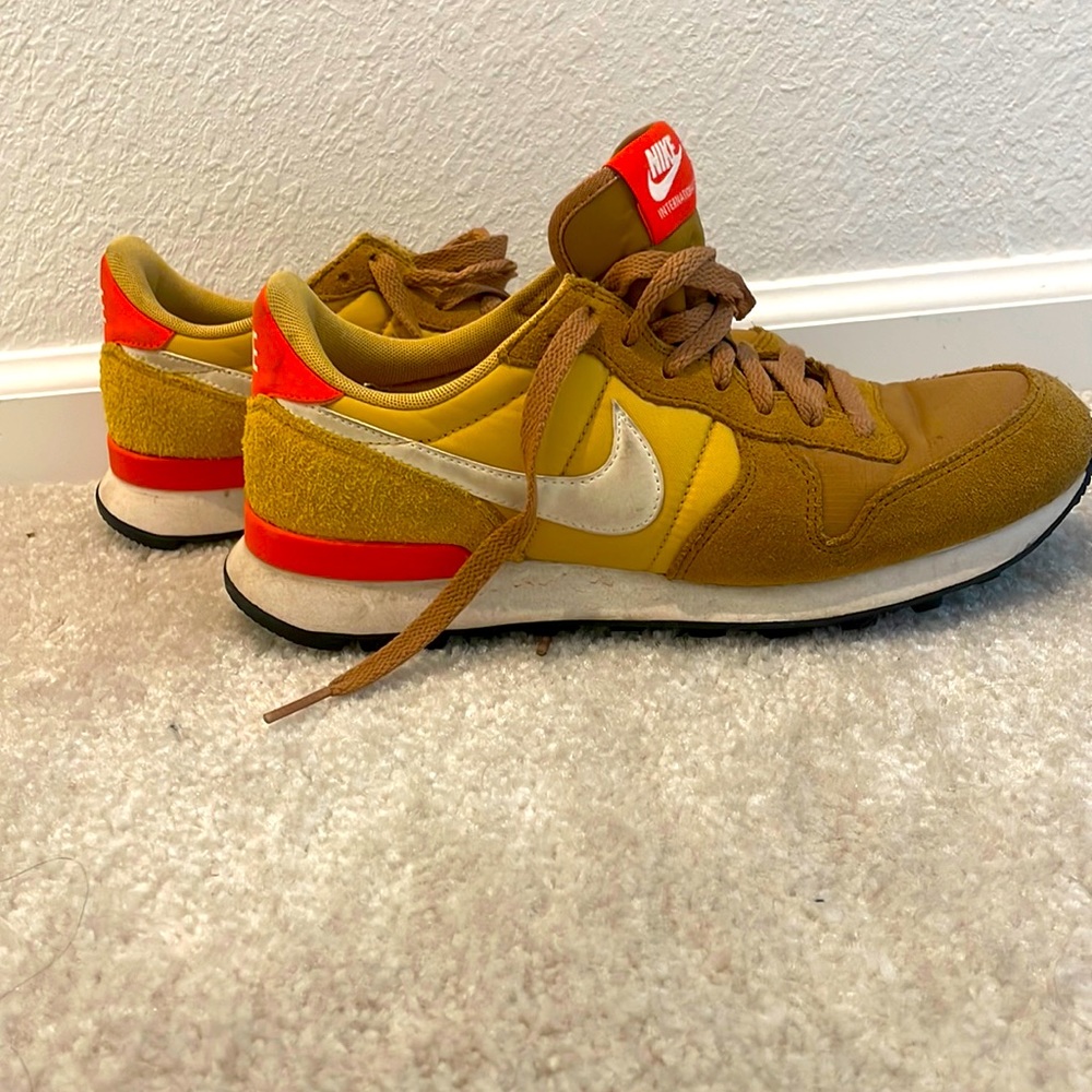Gold and orange Nike internationalist